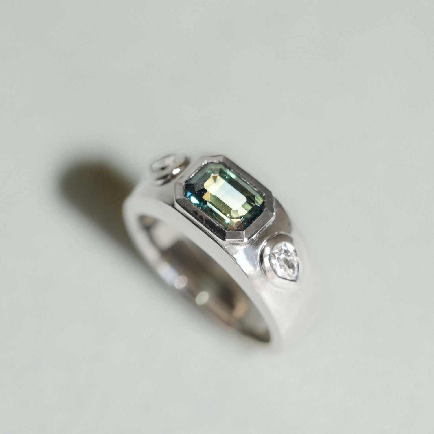 ethical Isla engagement ring by E.C.One London. recycled Platinum, Geen sapphire and diamond chunky engagement ring made in our B Corp London workshop