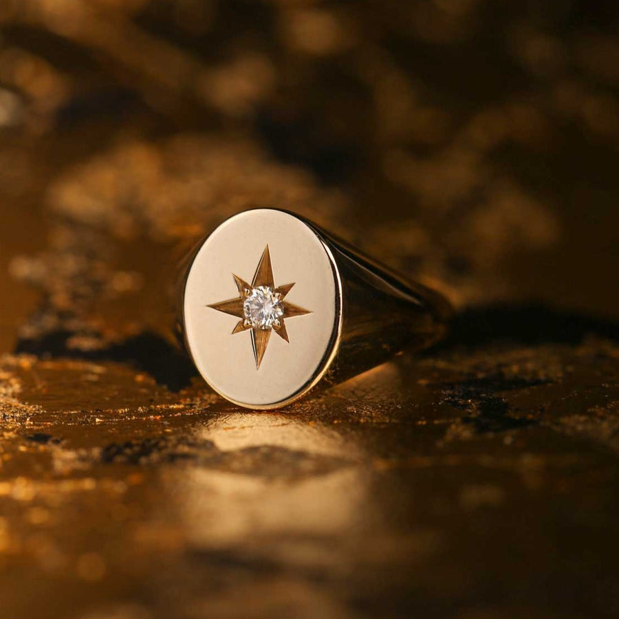Oval signet ring with star set diamond