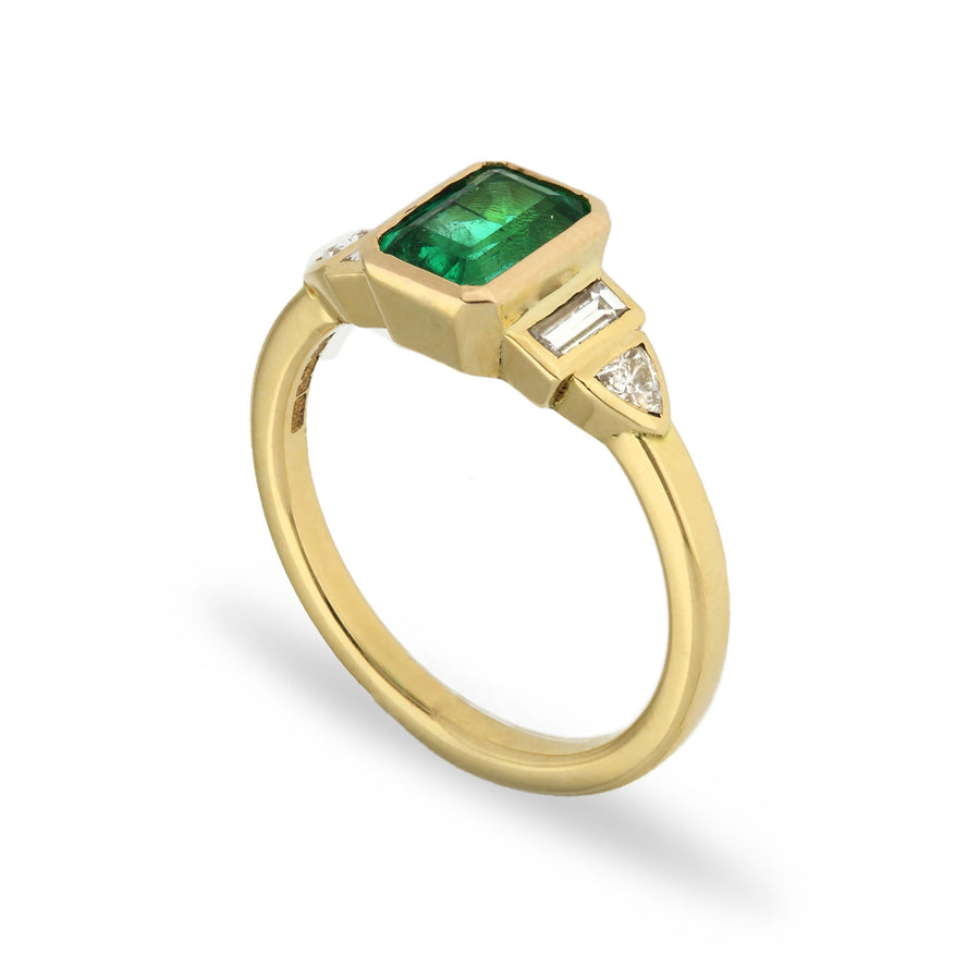 Daphne deco inspired emerald and diamond engagement ring in recycled yellow gold by EC One London