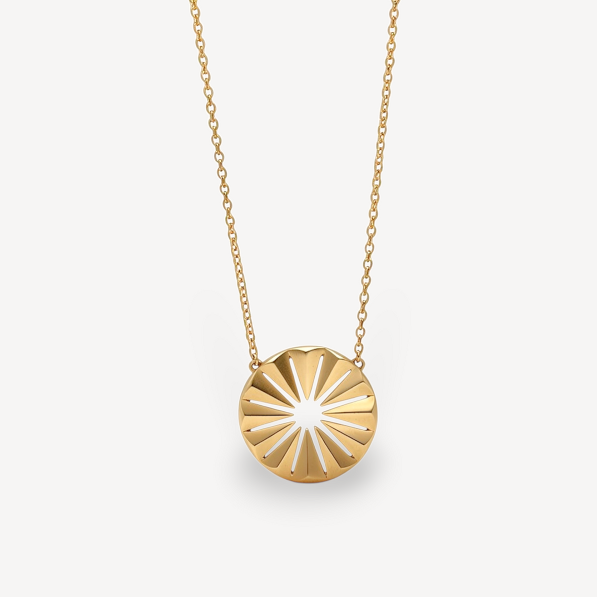 EC One Polaris Radial necklace featuring a hand-carved circular gold-plated recycled silver pendant on a fine chain.
