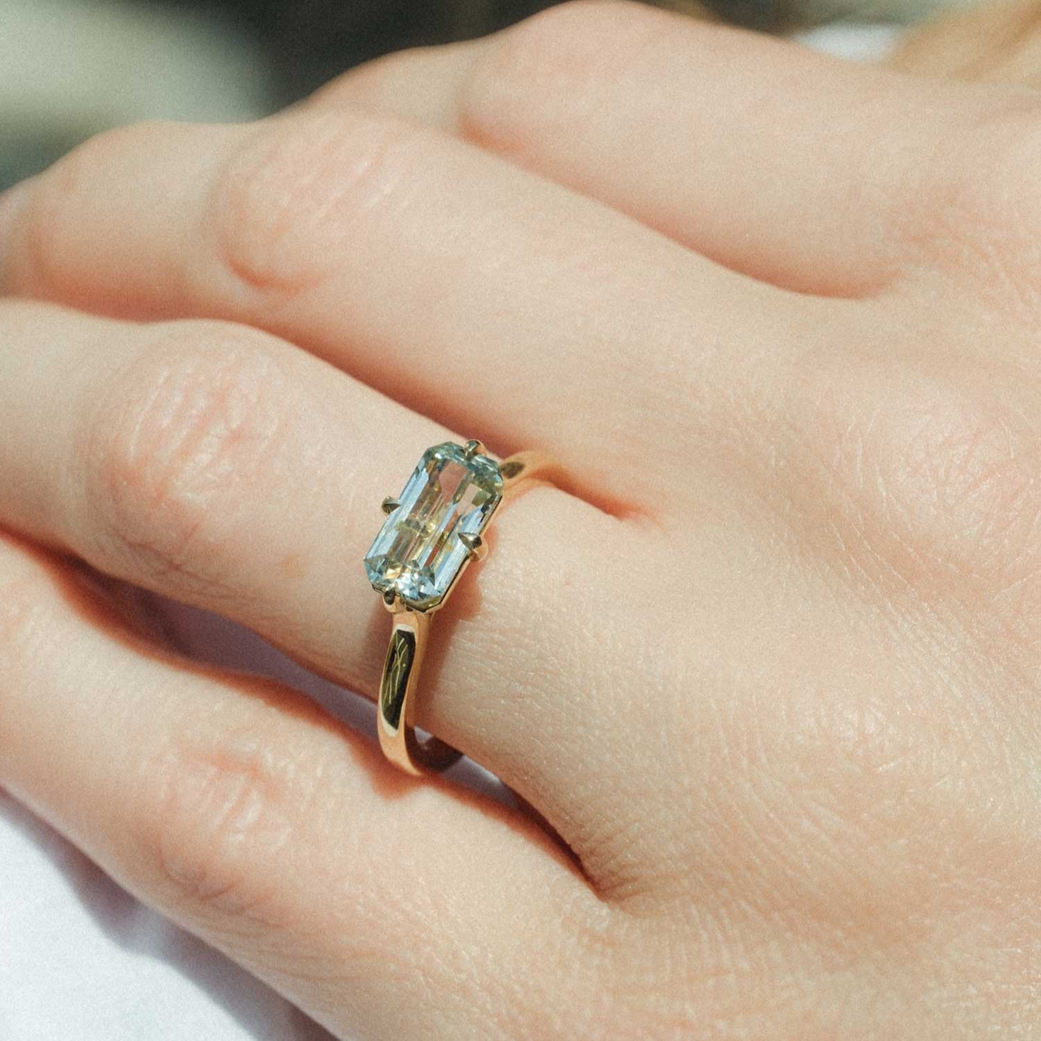 MILA Gold Solitaire Ring with Octagon Light Teal Sapphire made in recycled gold by ethical jeweller E.C.One London in our B Corp certified workshop