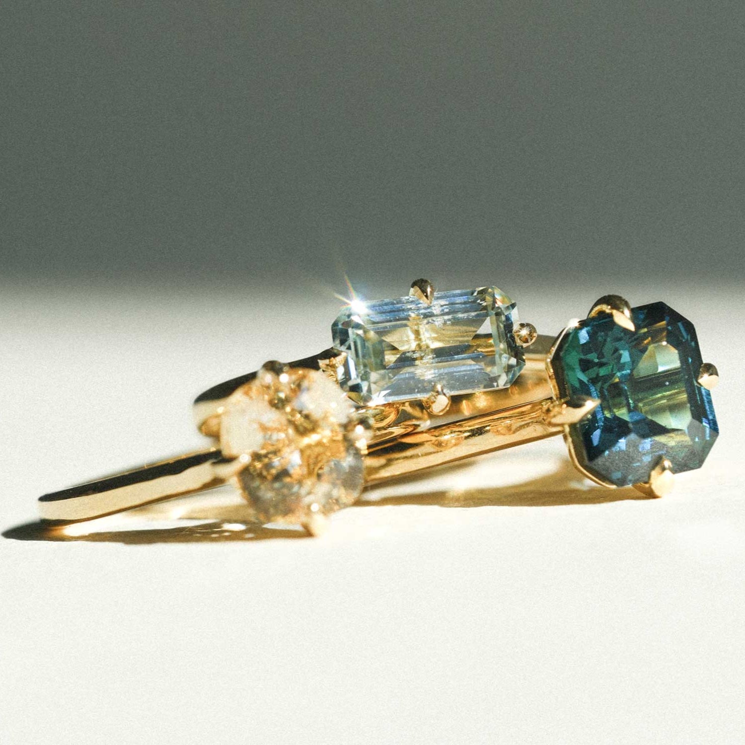 MILA Gold Solitaire Ring with Octagon Light Teal Sapphire made in recycled gold by ethical jeweller E.C.One London in our B Corp certified workshop