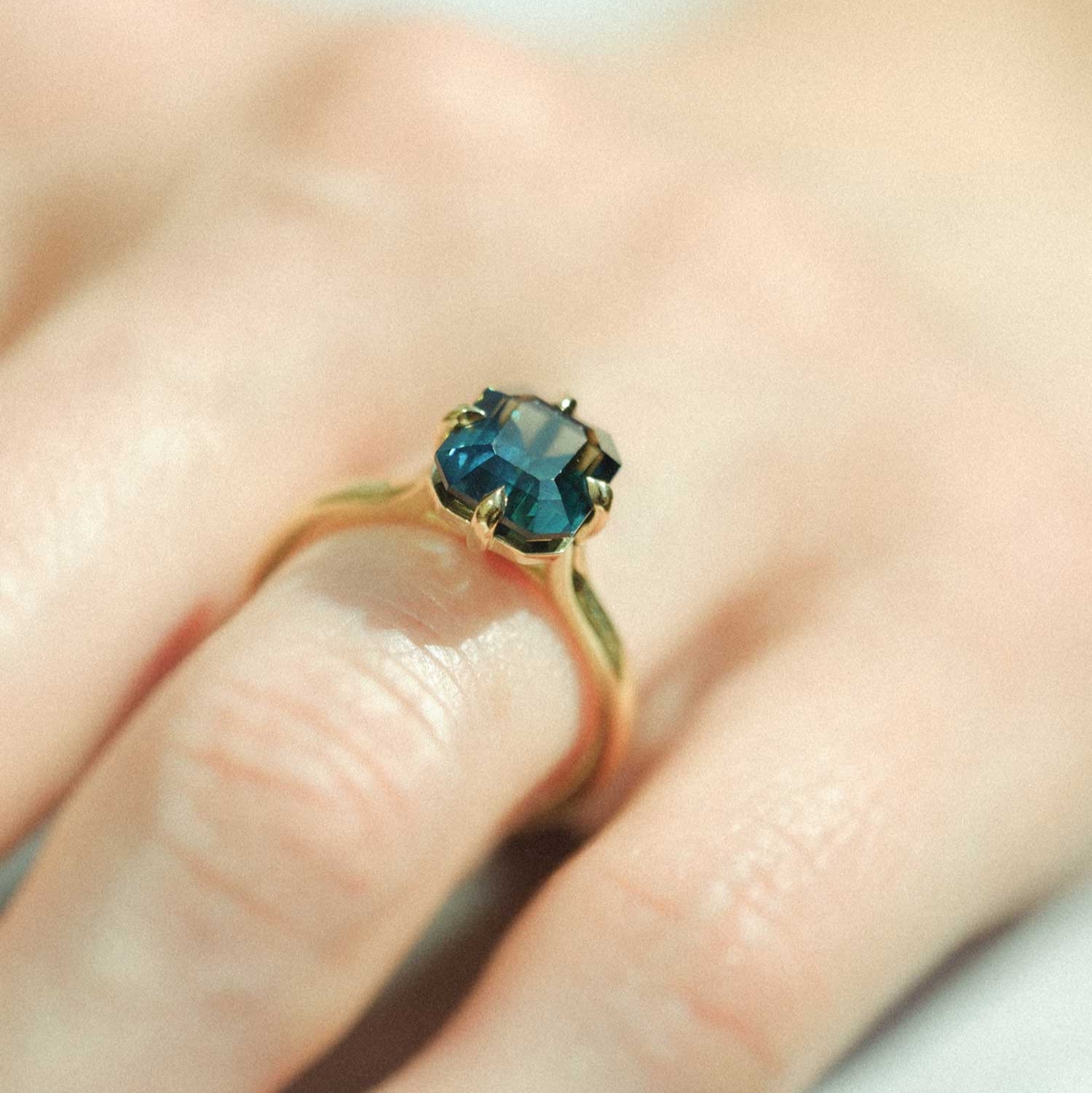 E.C.One MILA ethical teal sapphire engagement ring in recycled gold made in our London B Corp workshop