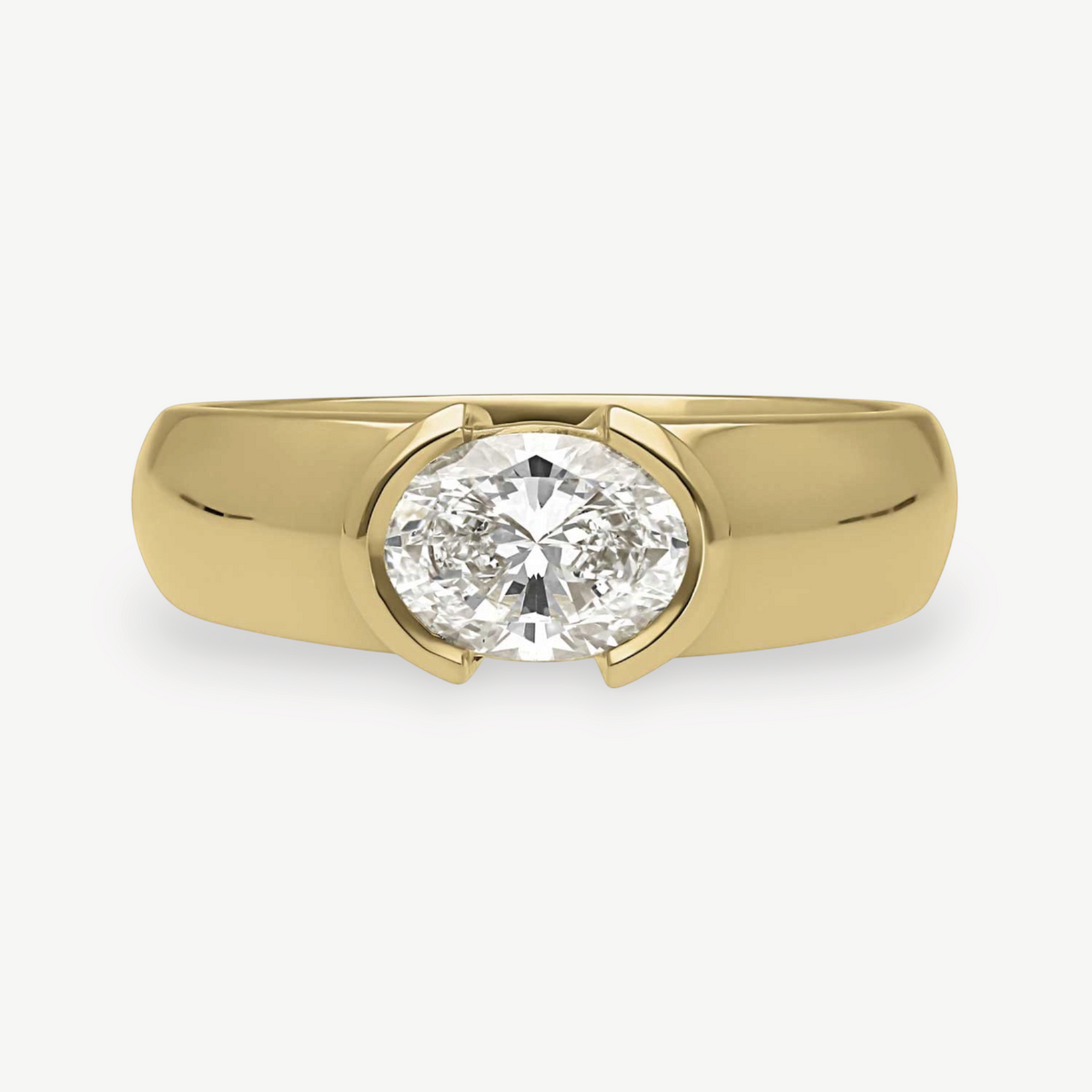 EC One EDIE engagement ring featuring an oval diamond in a chunky 18ct yellow gold demi-rub over setting
