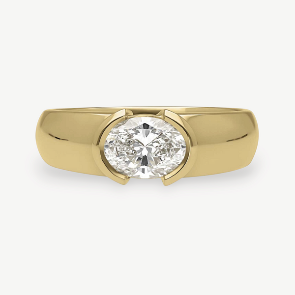 EC One EDIE engagement ring featuring an oval diamond in a chunky 18ct yellow gold demi-rub over setting