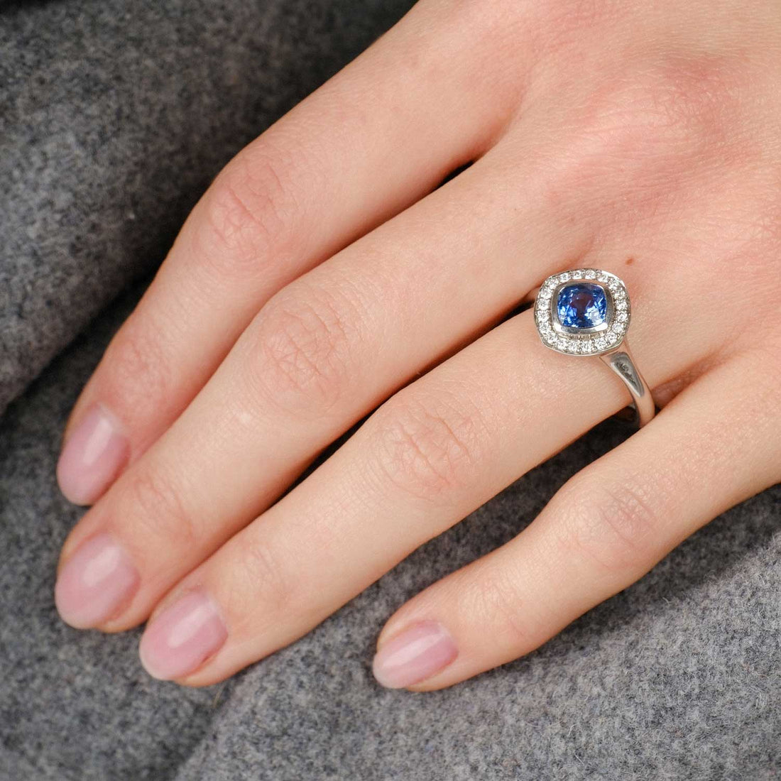 FRAME Platinum Cushion Blue Sapphire Ring with Diamond Halo