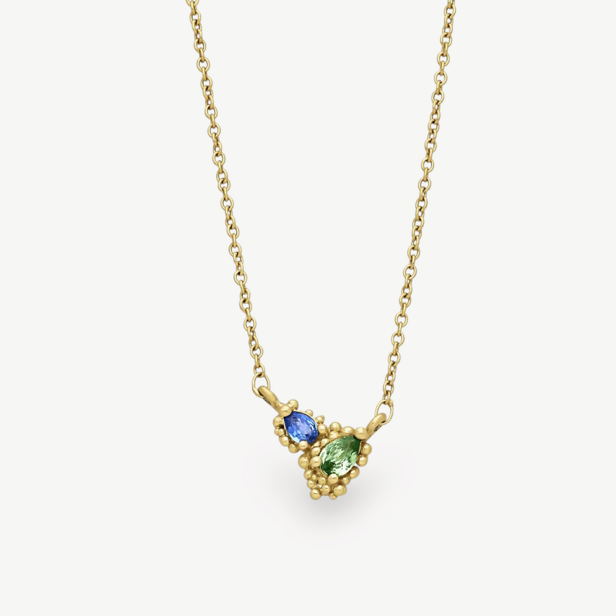 EC One DEWDROP pendant featuring pear-shaped blue and green sapphires in granulated 18ct recycled yellow gold