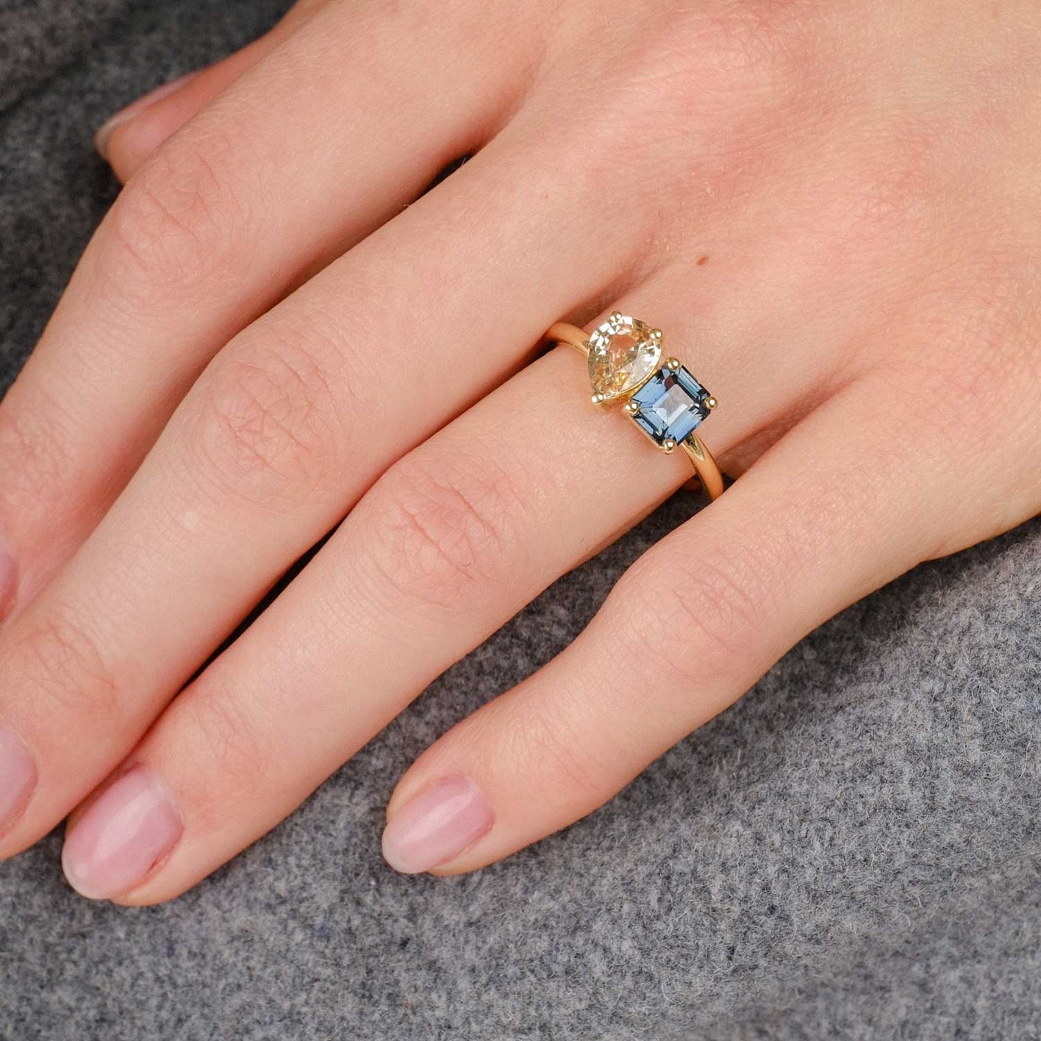 ethical engagement ring by E.C.One London Toi et Moi ring with teal and peach sapphires. Made in recycled gold in our onsite B Corp workshop