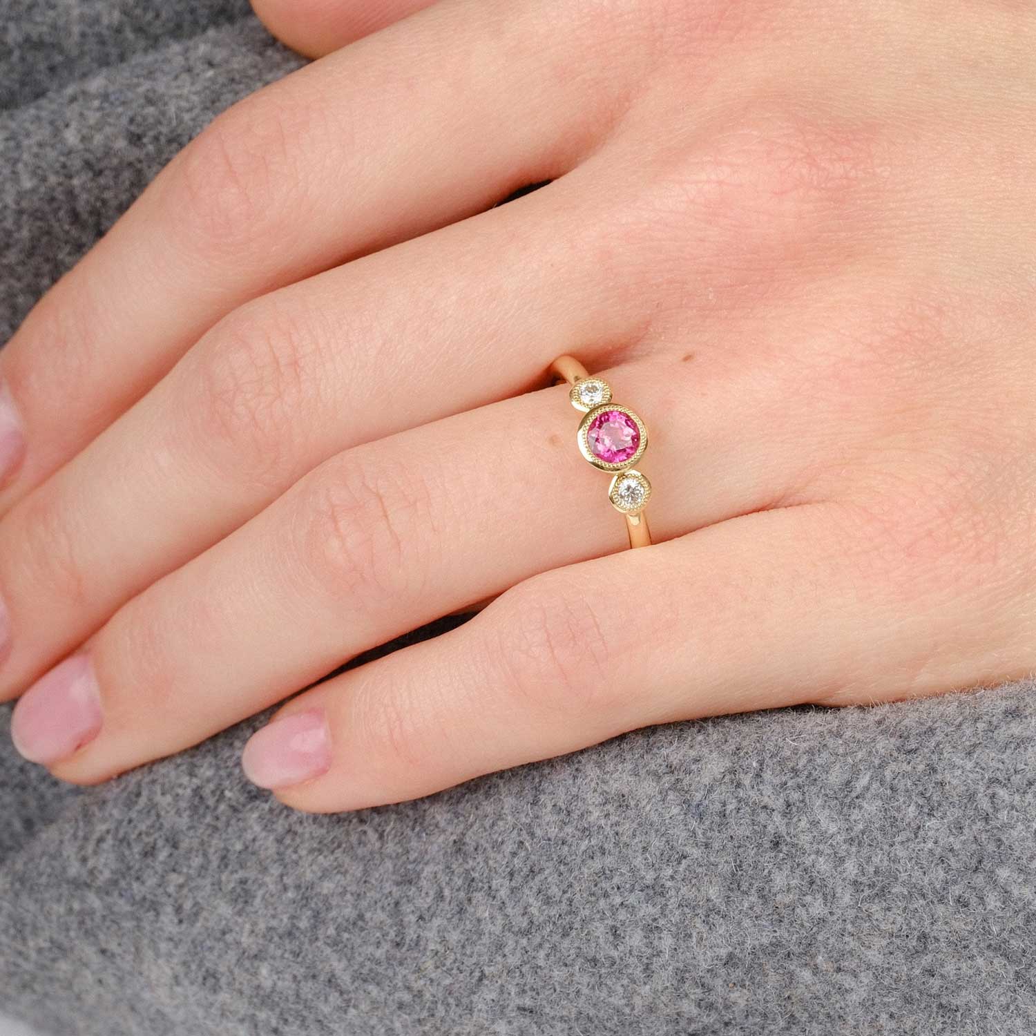 E.C.One ethical Nina engagement ring with Thai Rudy and diamond set in recycled yellow gold. Handmade in our onsite London B Corp certified workshop.