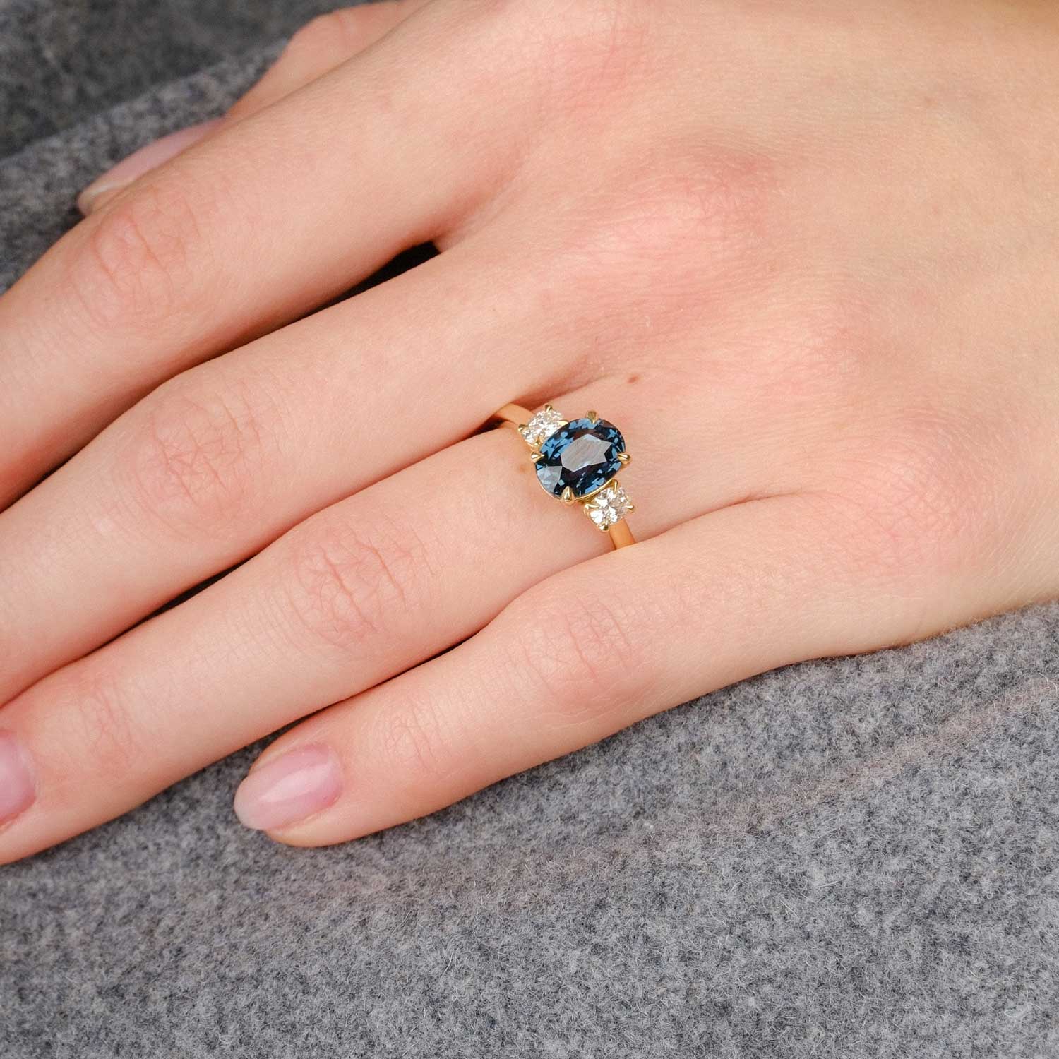 E.C.One London ethical OTTILIE Teal Oval Sapphire and Diamond Yellow Gold Trilogy Engagement Ring hand made in our B Corp London workshop