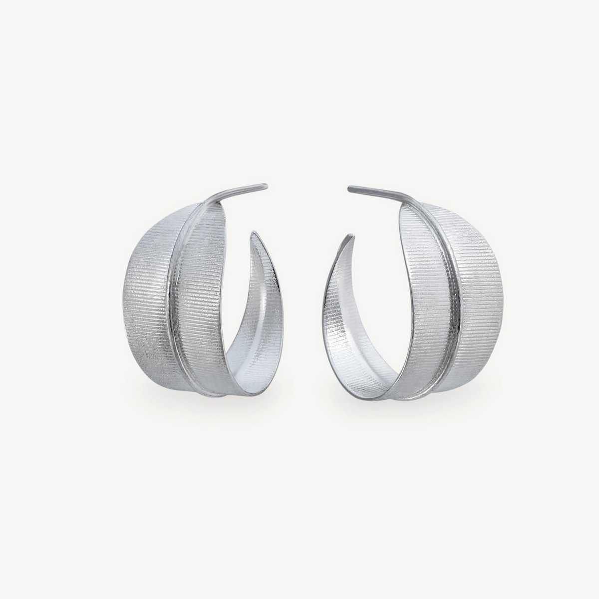 EC One Phoenix medium hoop earrings in textured sterling silver with a curved leaf-inspired design