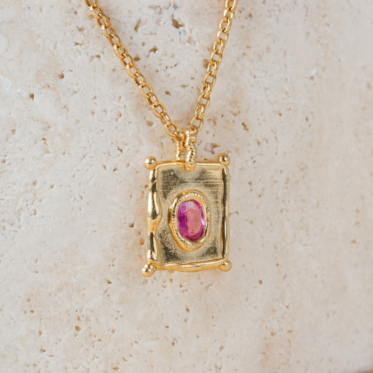 EC One TABLET mini pendant in gold plated recycled silver with a central pink sapphire on a delicate chain