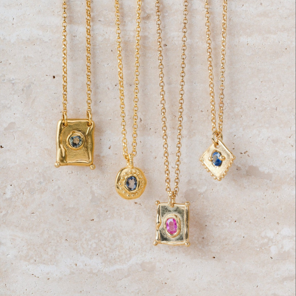 EC One TABLET mini pendant in gold plated recycled silver with a pink sapphire gemstone on a delicate chain