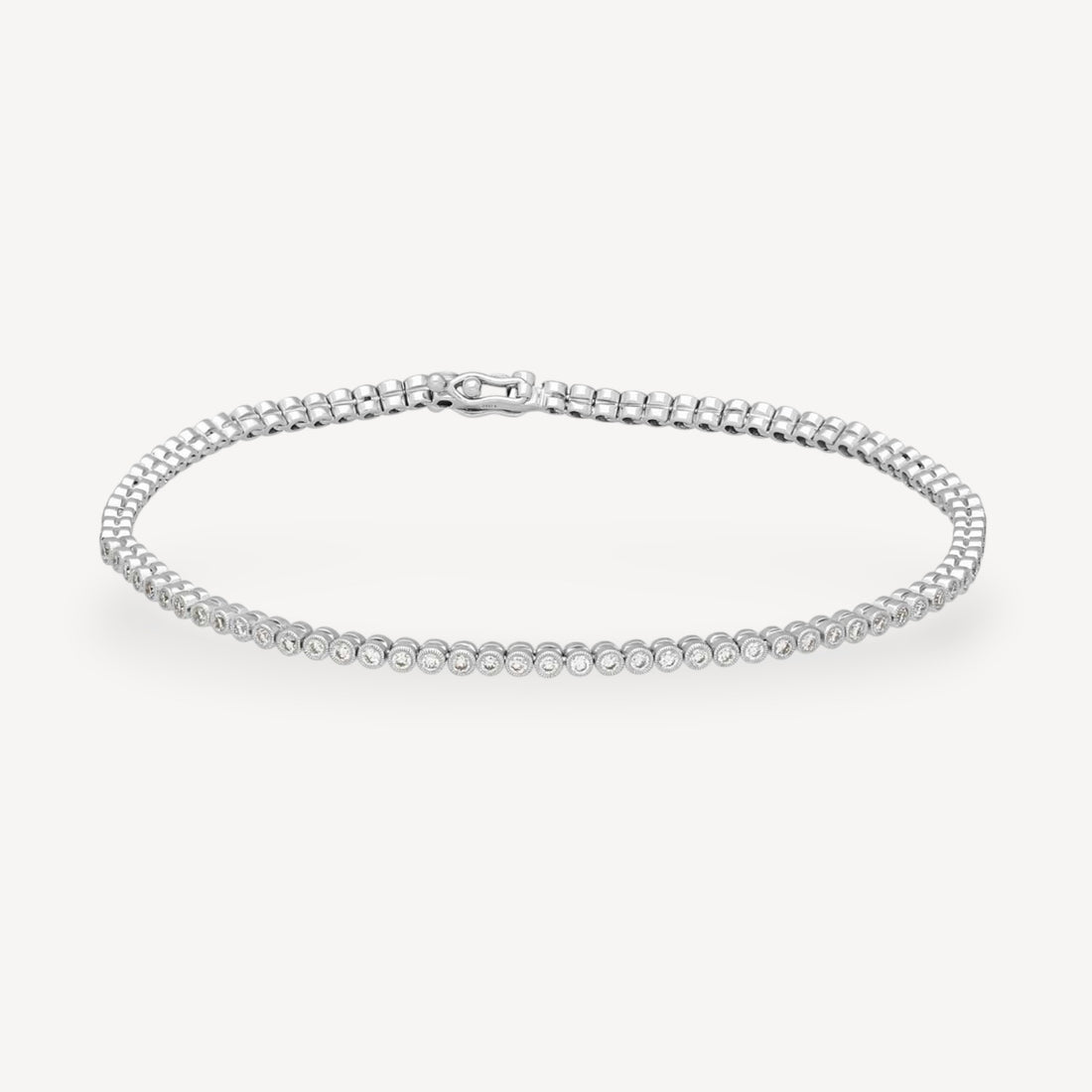 Bezel-Set Diamond Tennis Bracelet in White Gold by Ungar & Ungar at E.C.One London