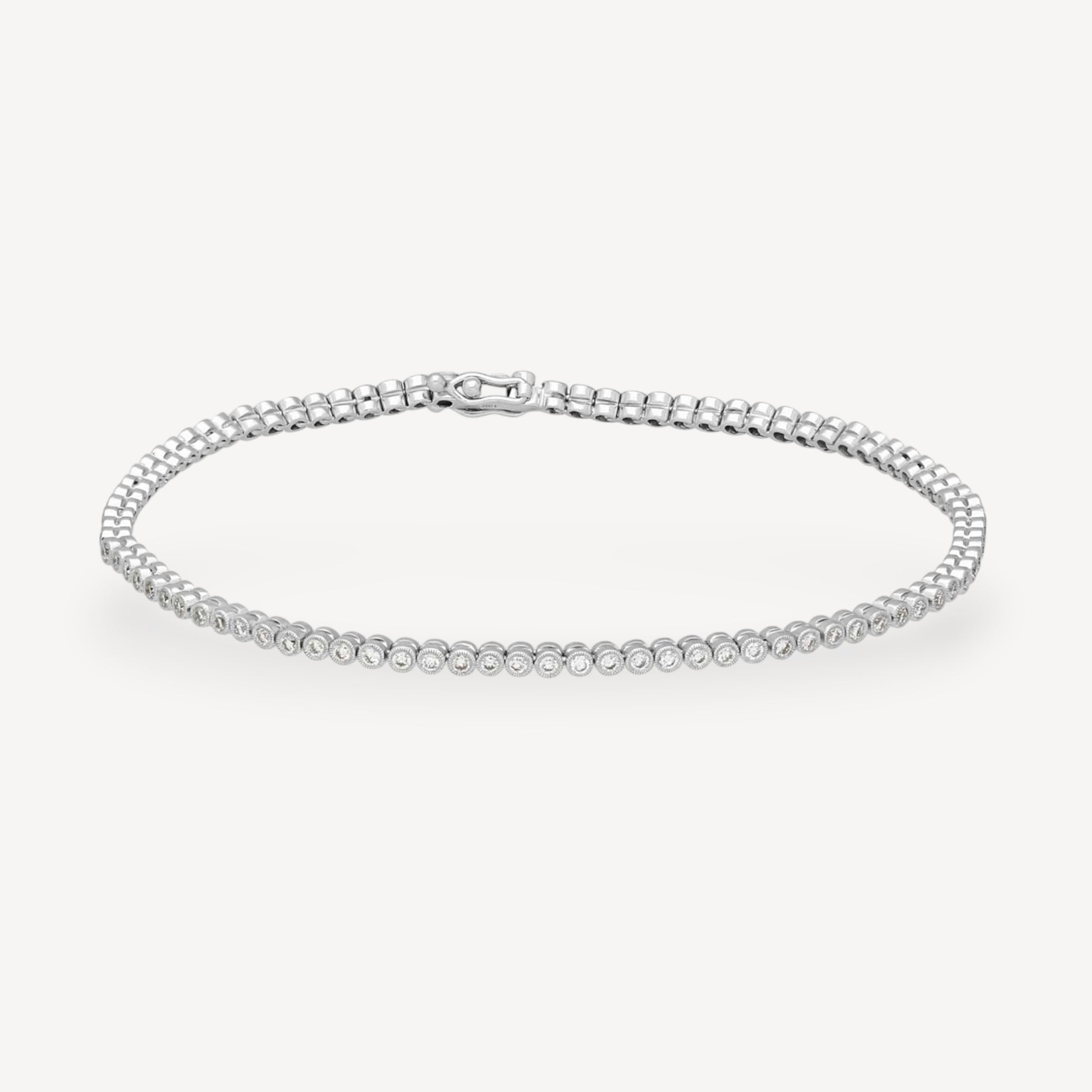 Bezel-Set Diamond Tennis Bracelet in White Gold by Ungar & Ungar at E.C.One London
