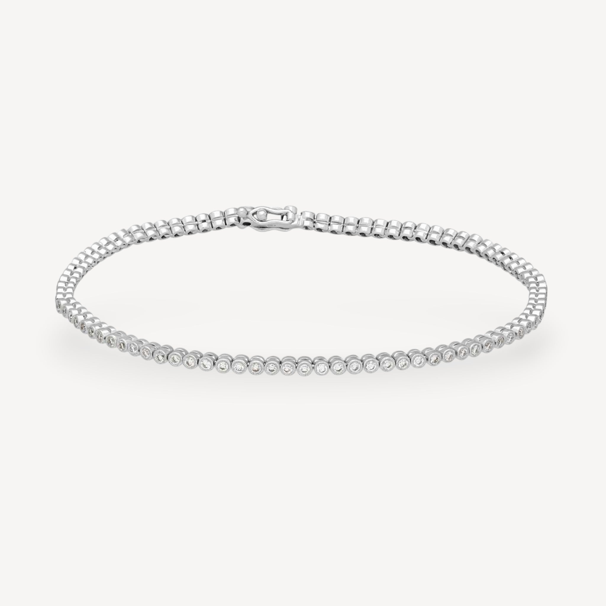 Bezel-Set Diamond Tennis Bracelet in White Gold by Ungar & Ungar at E.C.One London