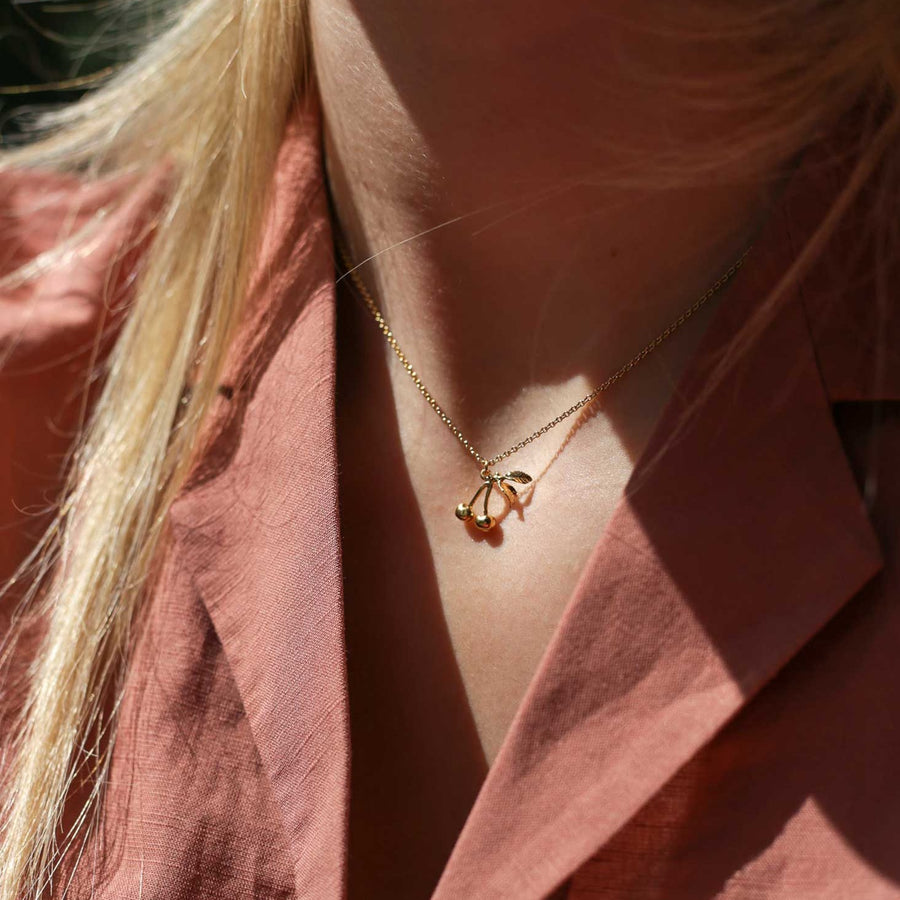 Alex Monroe at ethical jewellers EC One London small and sweet cherry necklace in gold plated recycled silver