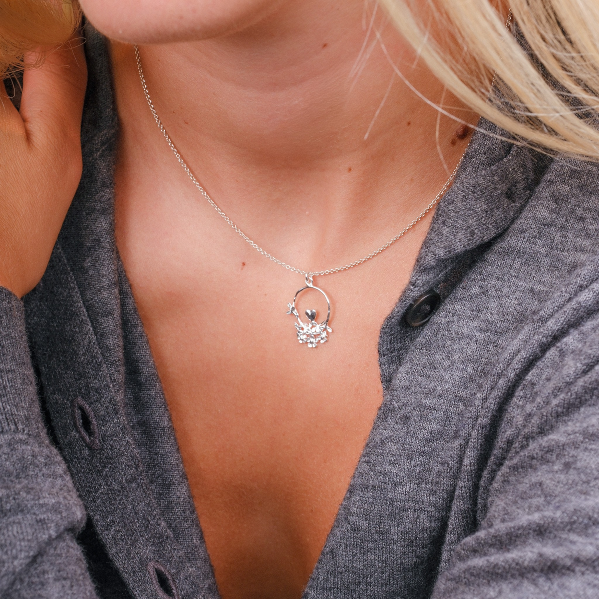 EC One Alex Monroe 40th anniversary recycled silver necklace featuring a heart, leaves, and flowers on a loop pendant