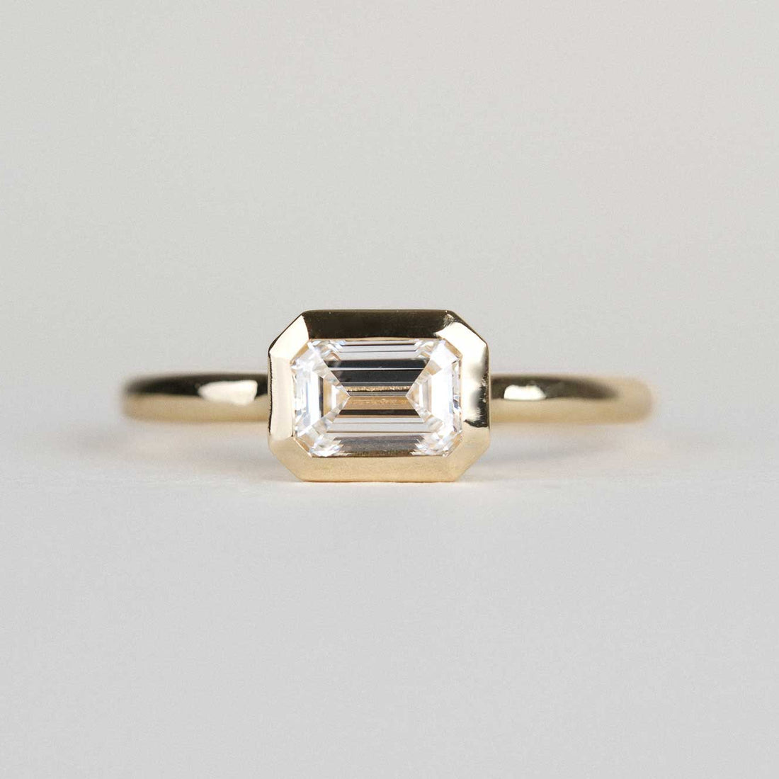 E.C.One AVA Yellow Gold Emerald Cut Diamond Engagement Ring hand made in our B Corp London workshop