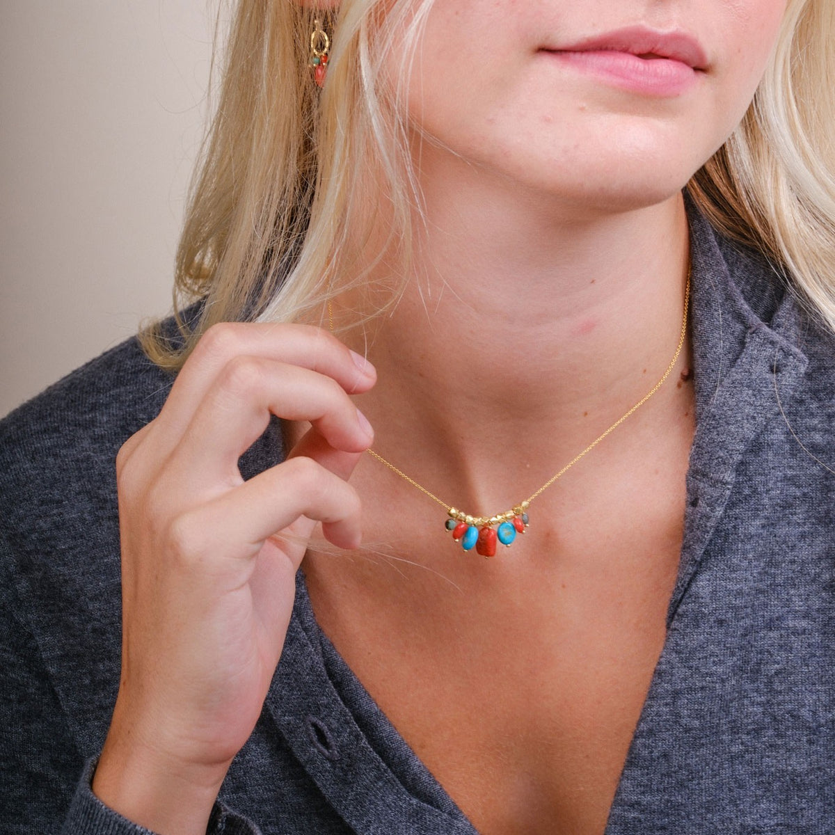 EC One COLLETTE necklace featuring coral and turquoise gemstone beads on a gold plated recycled silver chain