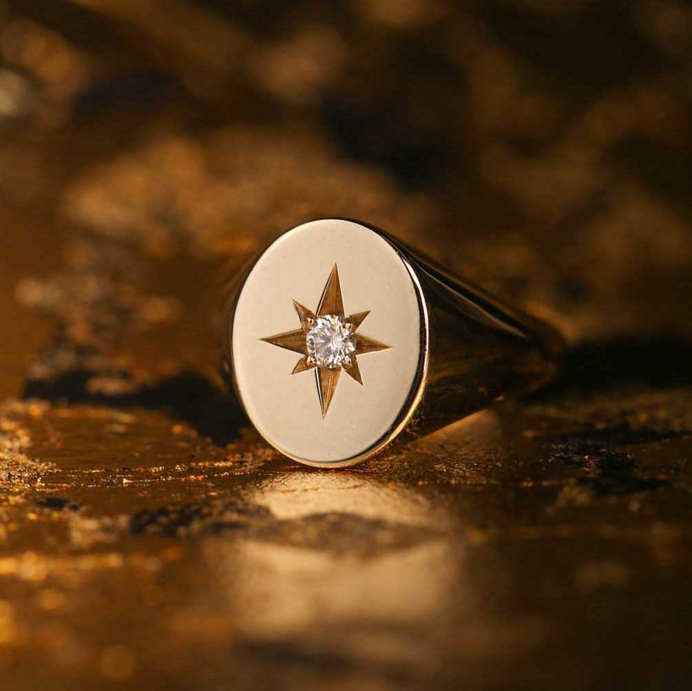 Oval Gold Signet Ring with star set Diamond