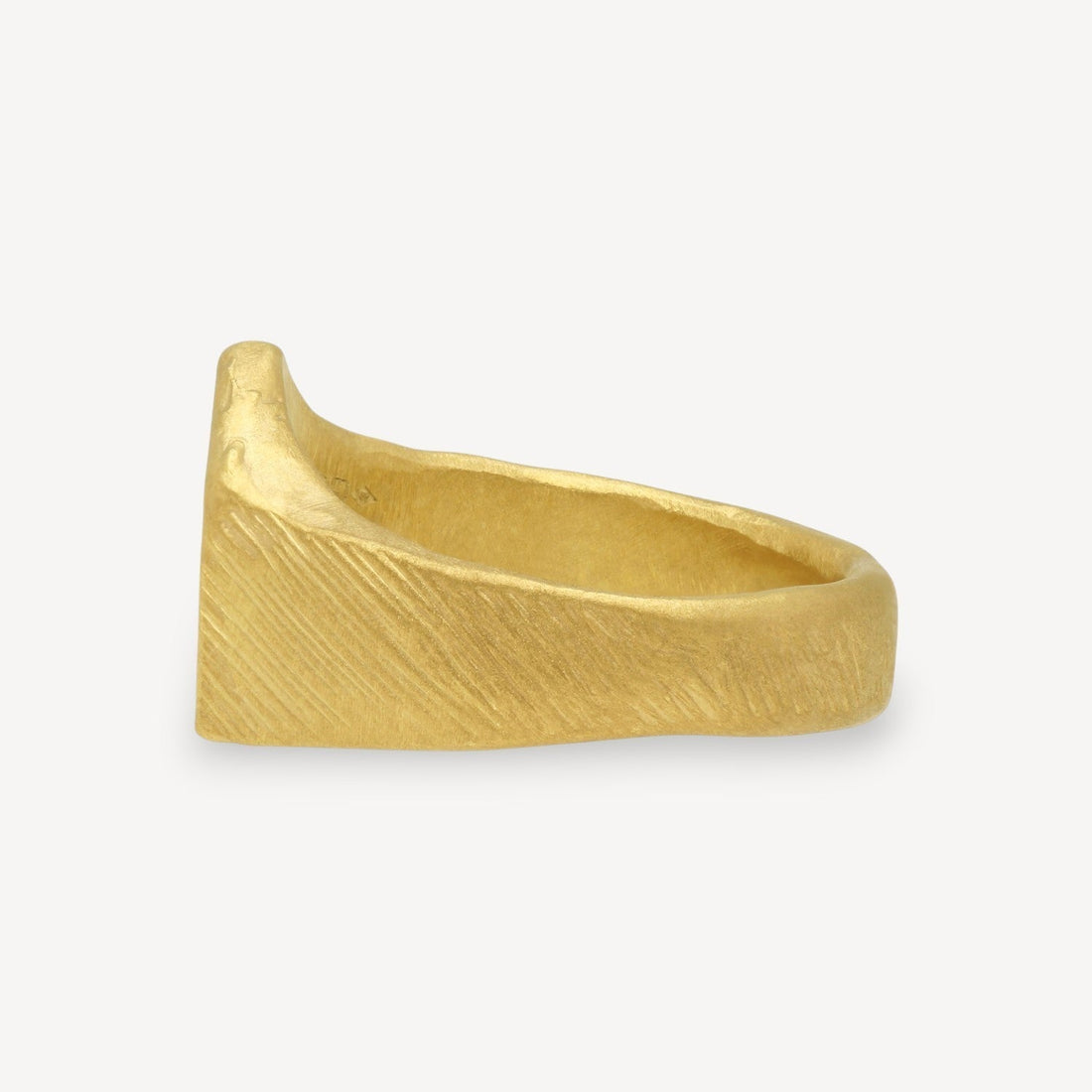 EC One gold plated ring featuring a textured, brushed finish and a unique sculptural band design.