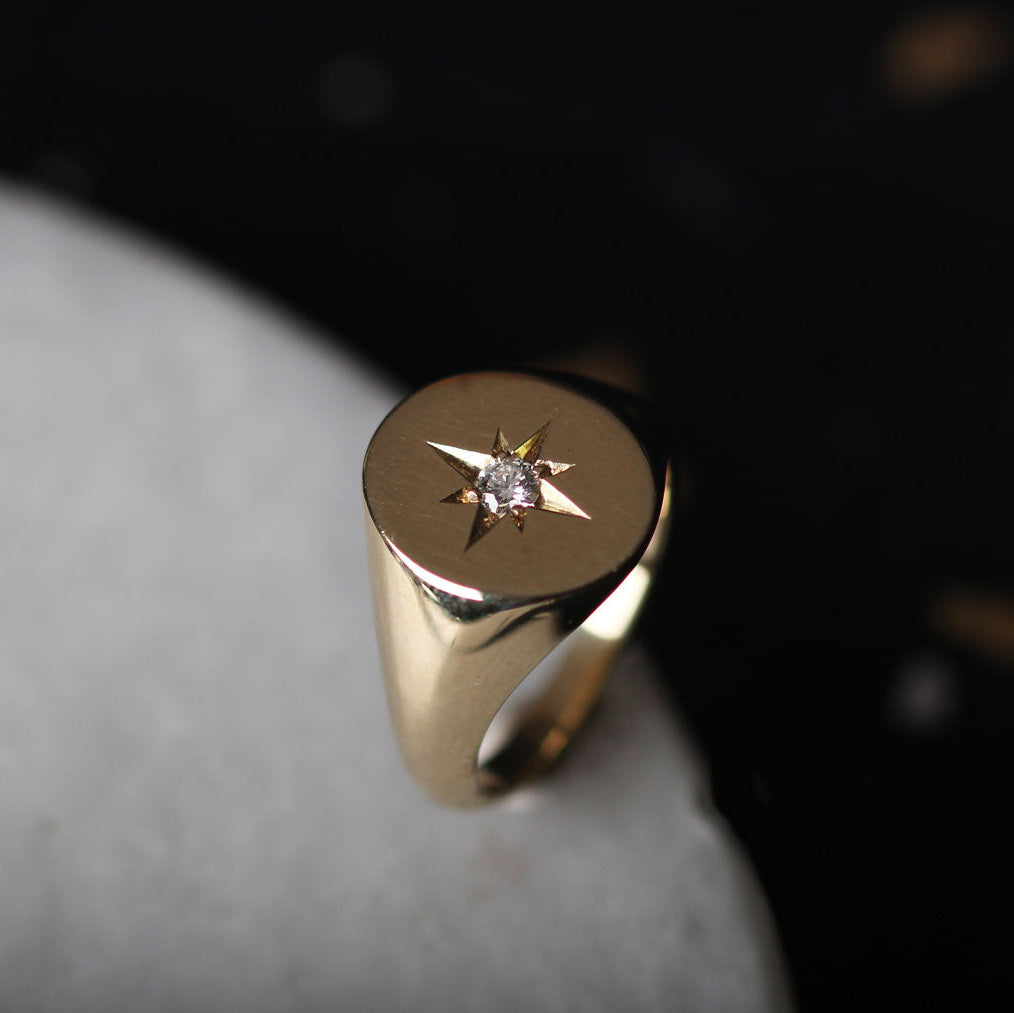 Oval Gold Signet Ring with star set Diamond