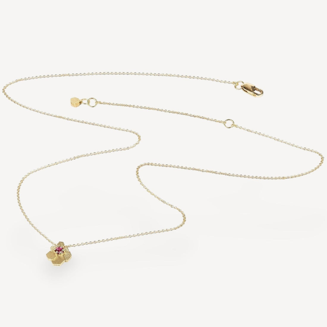 EC One HEX Mini Fan Chaos necklace in 18ct yellow gold with a vibrant ruby set in a geometric hexagonal pendant