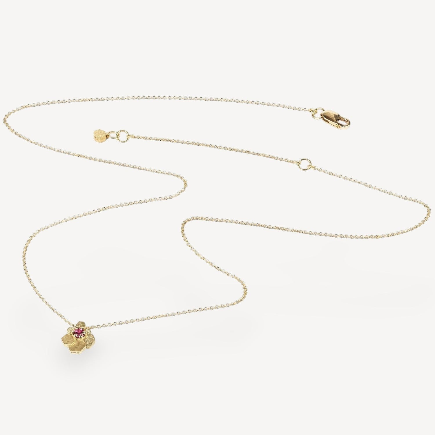 EC One HEX Mini Fan Chaos necklace in 18ct yellow gold with a vibrant ruby set in a geometric hexagonal pendant