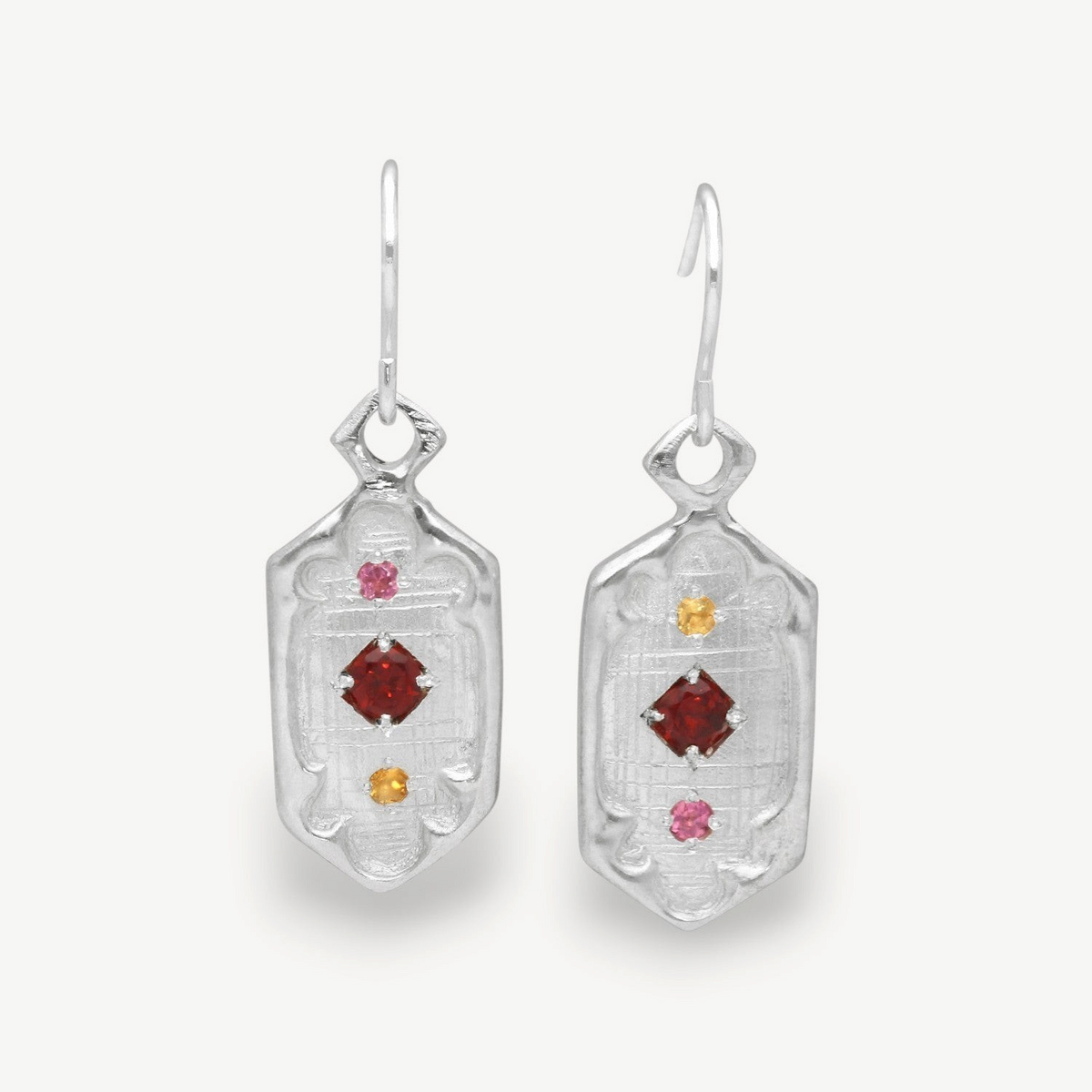 EC One Hex Windows drop earrings in silver featuring red and yellow autumnal gemstones in a geometric window design.