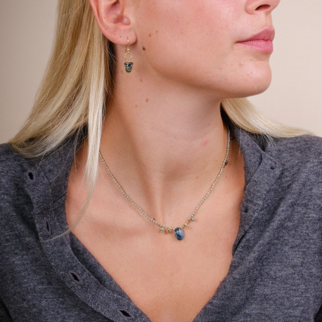 EC One MENTUCCIA necklace featuring emeralds, tourmaline, and gold-plated silver beads worn by a blonde model