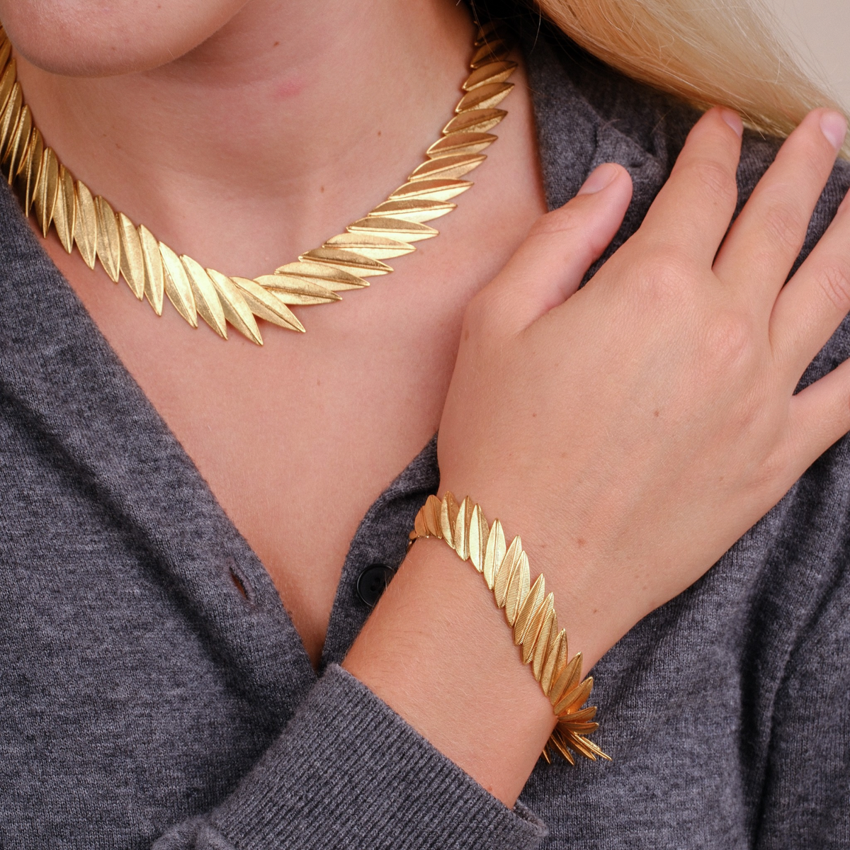 EC One PHOENIX gold plated recycled silver contour bracelet with a fluid leaf-like design worn on a wrist