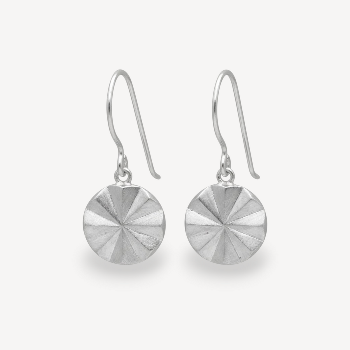 EC One Polaris starburst drop hook earrings crafted from recycled silver with a textured sunburst design.