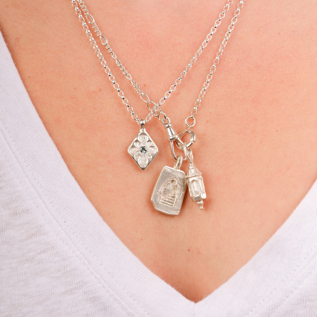 EC One silver Doorway Charm necklace featuring hand-carved wax-cast pendants on a delicate chain