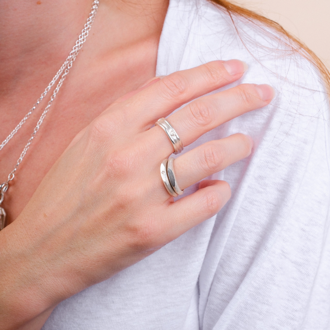 EC One silver skinny signet ring worn on a finger with a textured hand-carved finish