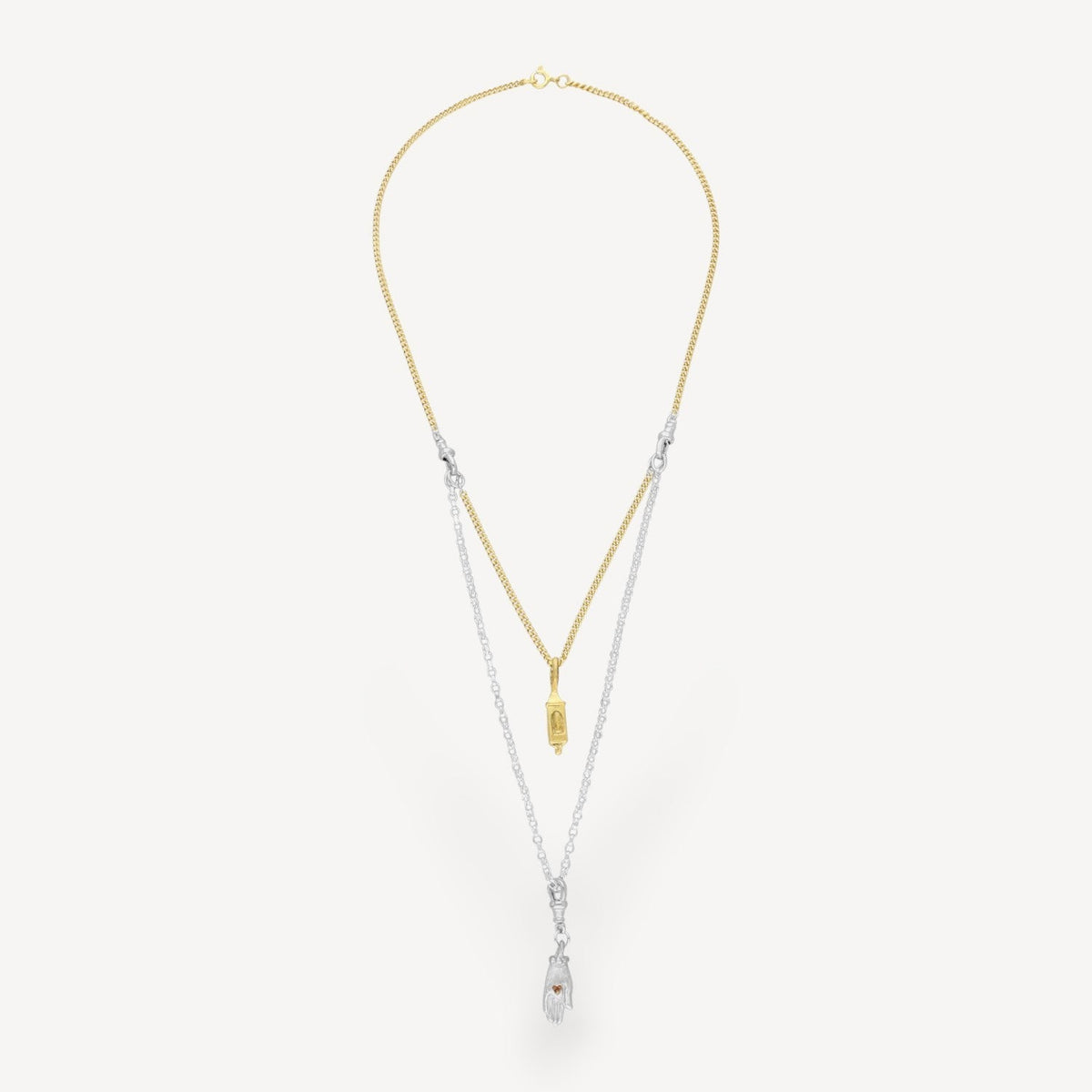 EC One interchangeable two-tone necklace featuring a gold chain with lantern charm and silver chain with hand charm