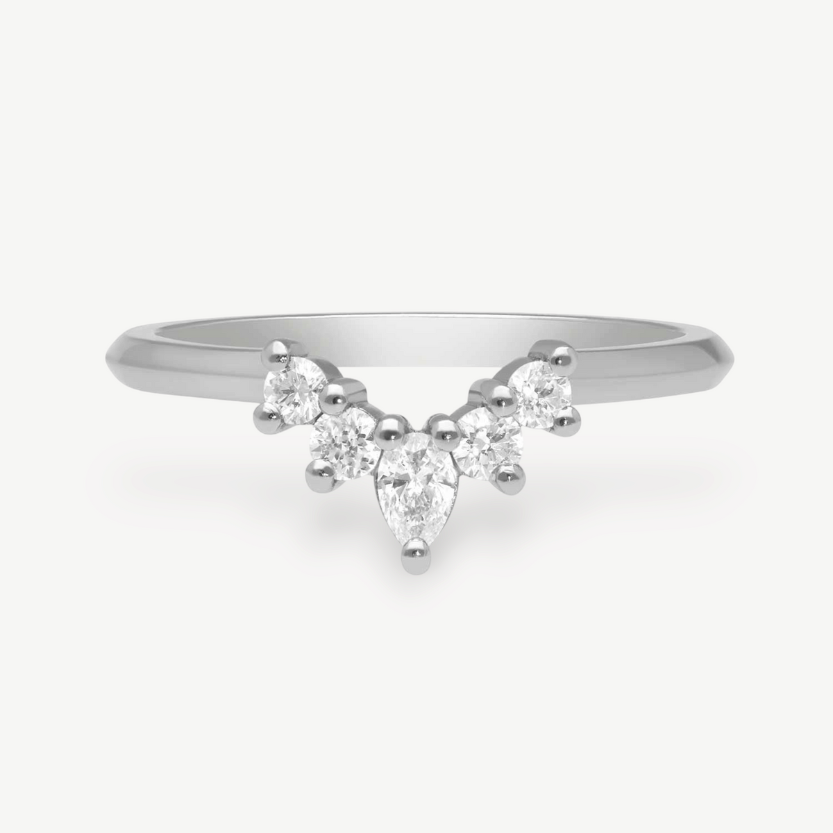 EC One platinum tiara shaped wedding ring featuring a central pear-cut diamond and four brilliant-cut side diamonds.