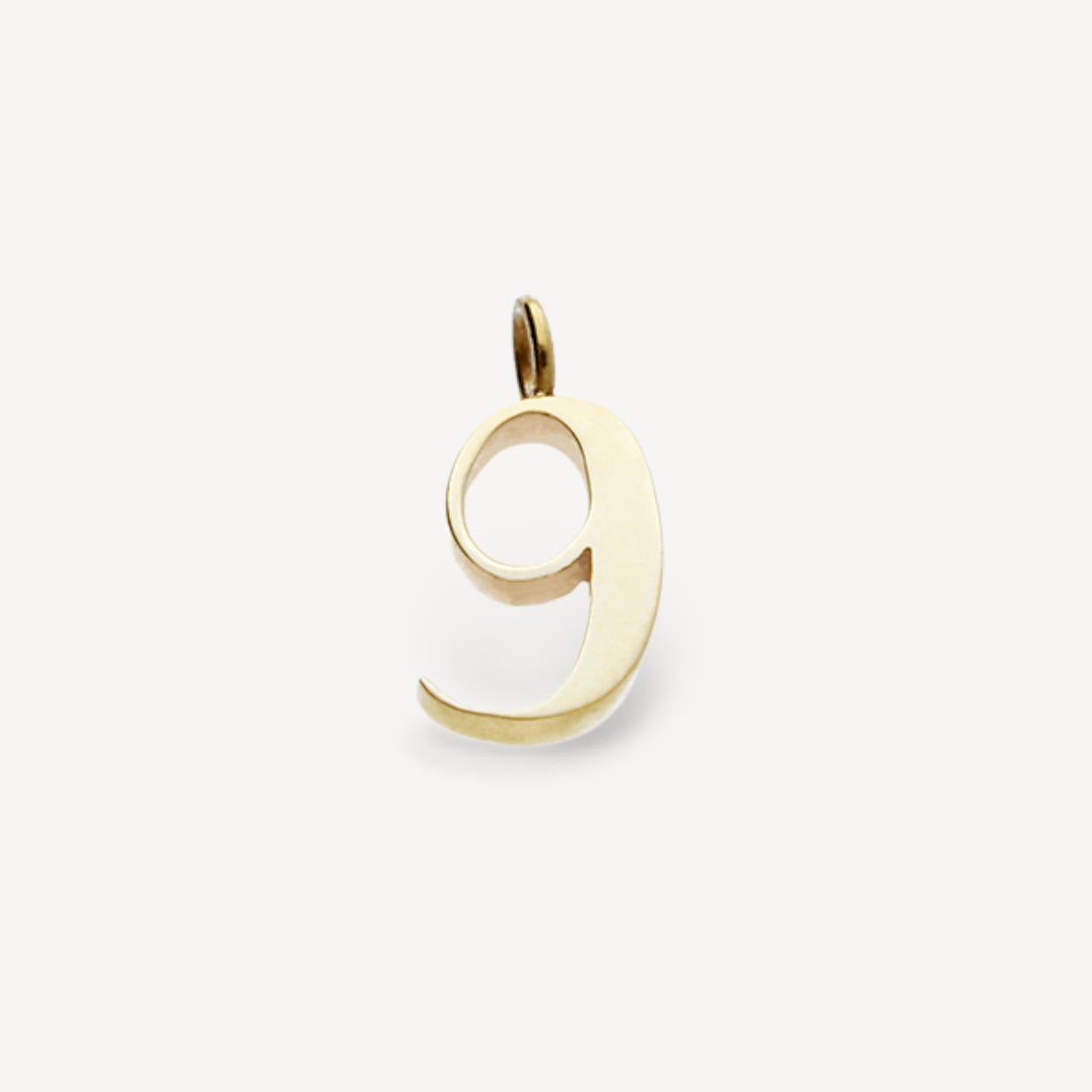 Gold number "9" charm pendant