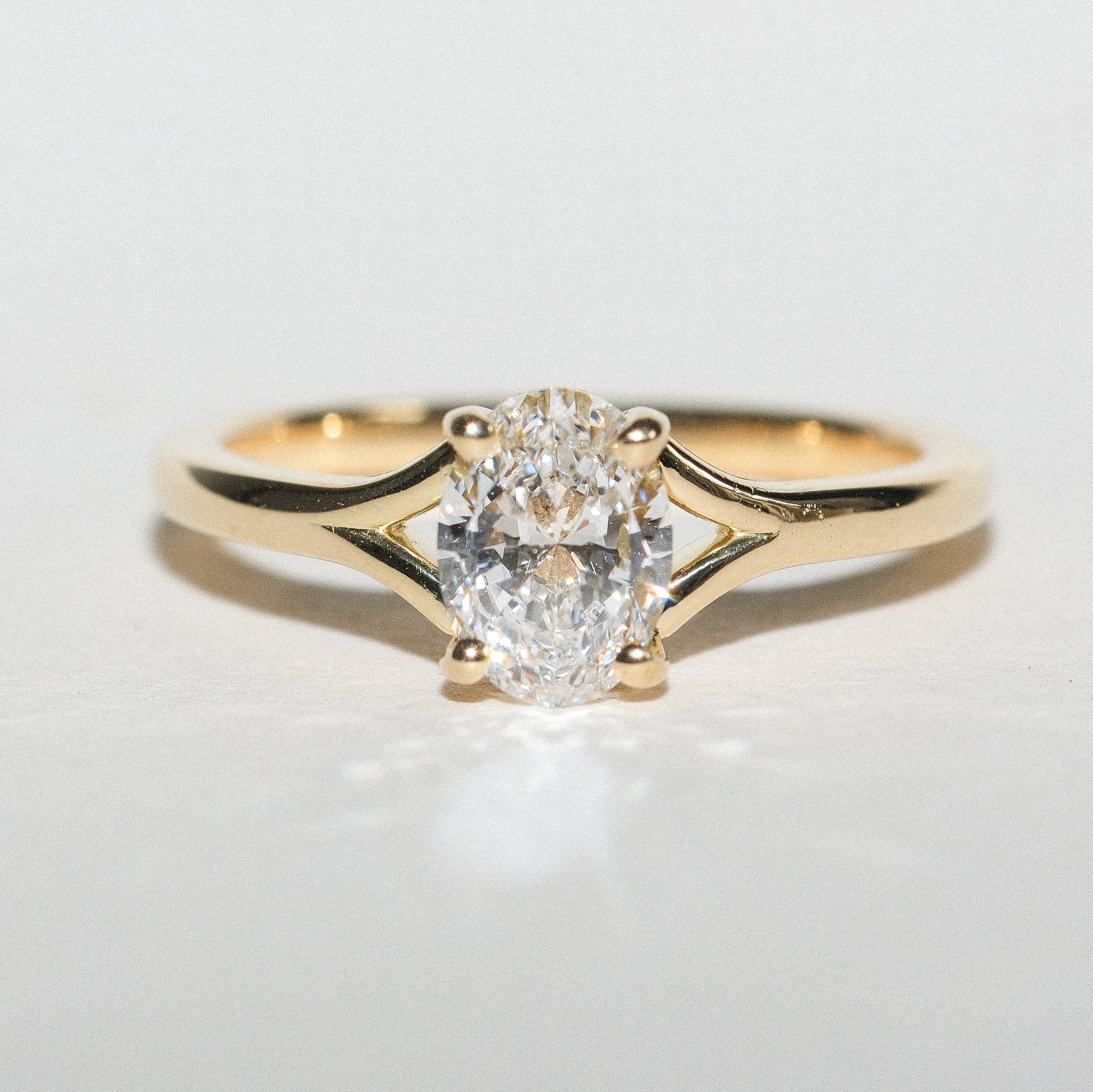 JUNO Gold Solitaire Ring with Oval White Diamond