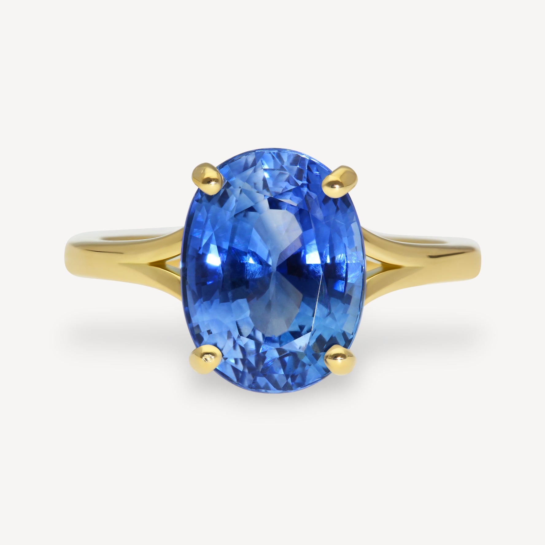 JUNO Gold Solitaire Ring with Oval Blue Sapphire