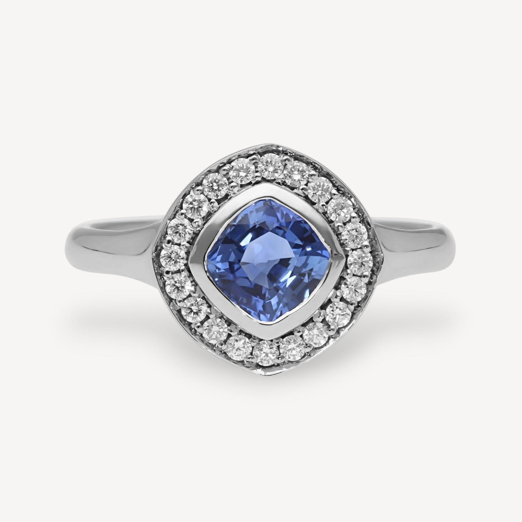 FRAME Platinum Cushion Blue Sapphire Ring with Diamond Halo