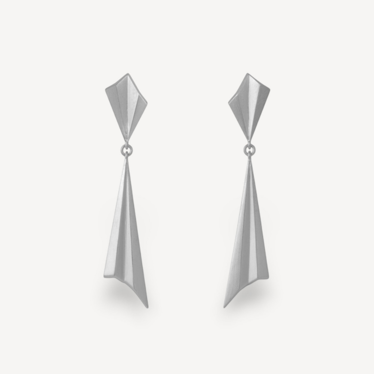 EC One geometric drop earrings in recycled silver featuring long pleated spikes and matching pleated studs.