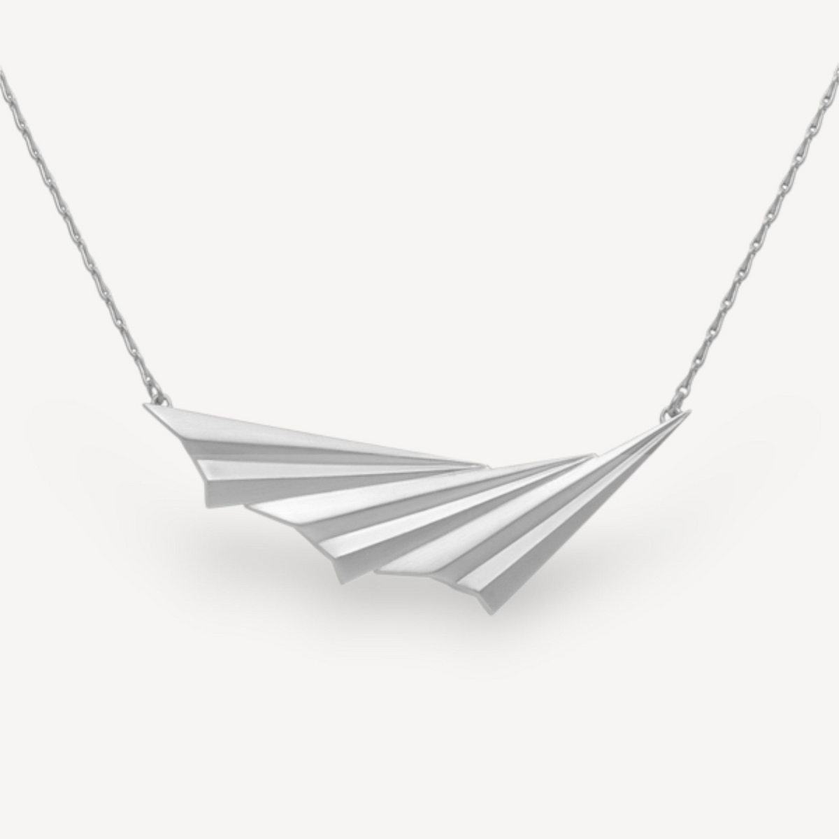 EC One Pleated Wave necklace in recycled silver featuring an asymmetric fan-shaped pendant with layered pleats.