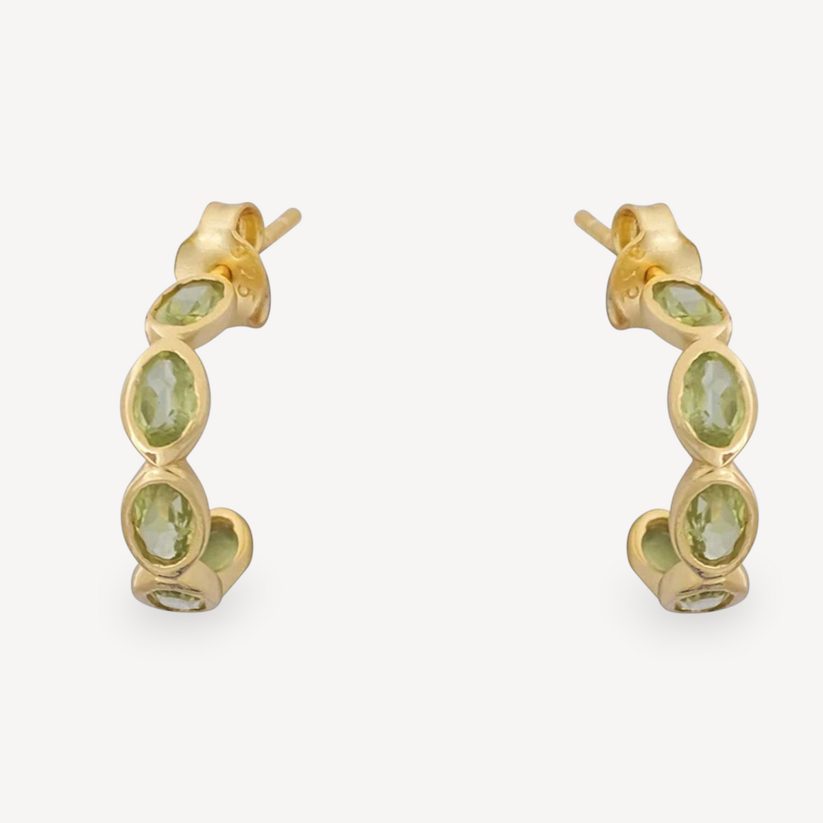 EC One LUNA hoop earrings in gold plated silver featuring seven oval faceted peridot stones on each hoop.