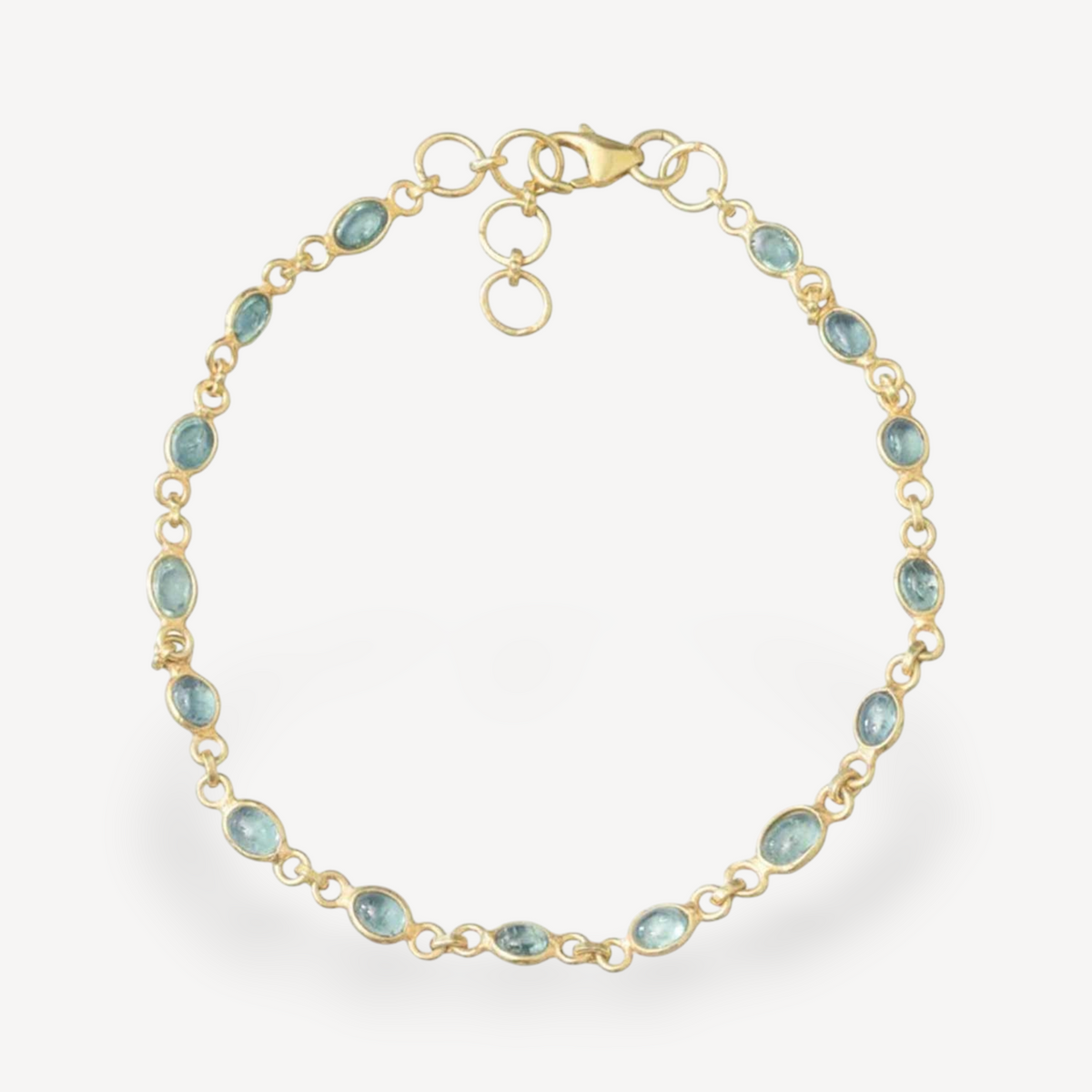 EC One gold link chain bracelet featuring oval green tourmaline gemstones set in delicate gold links