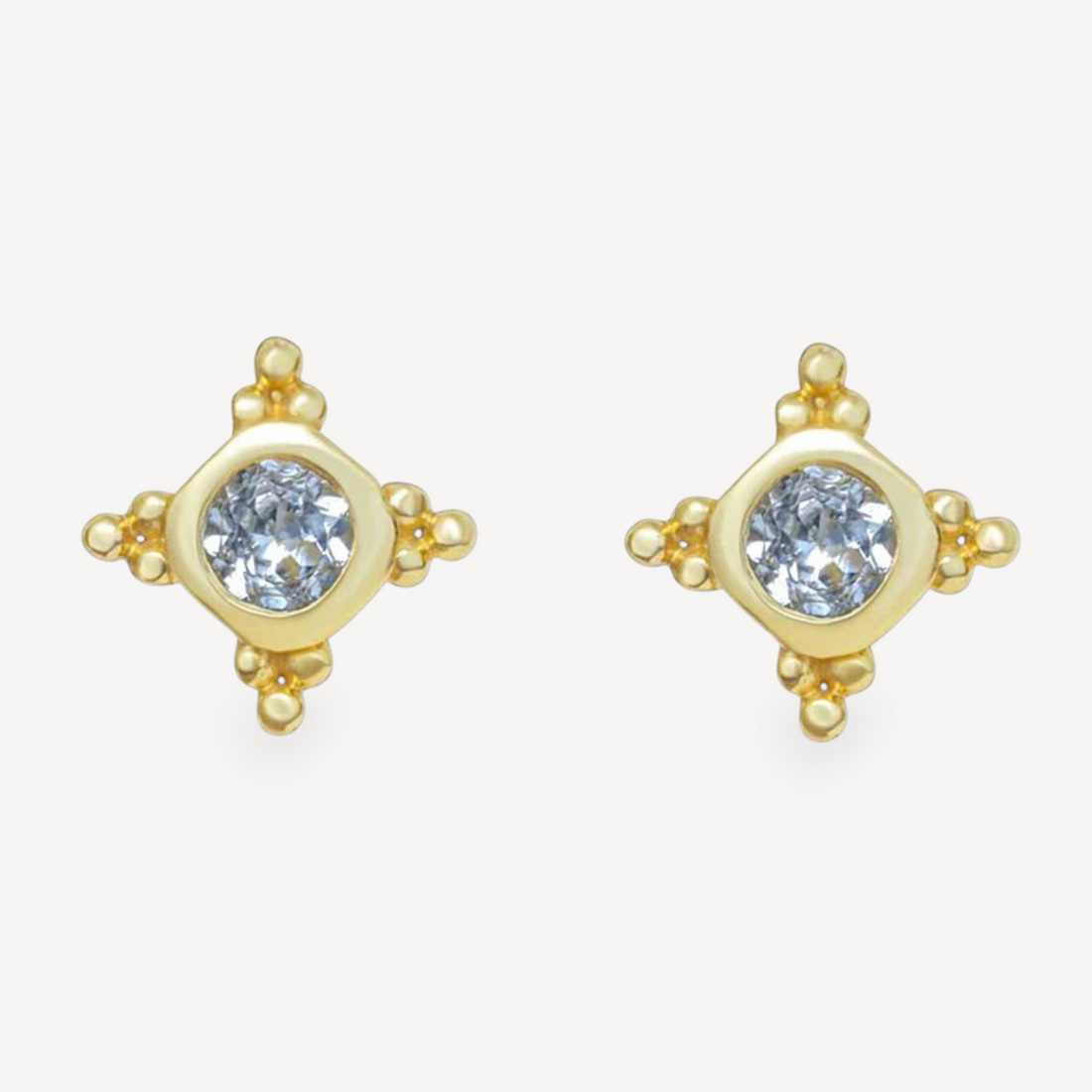EC One STARBURST stud earrings featuring round blue topaz gemstones set in gold plated silver with star detailing.