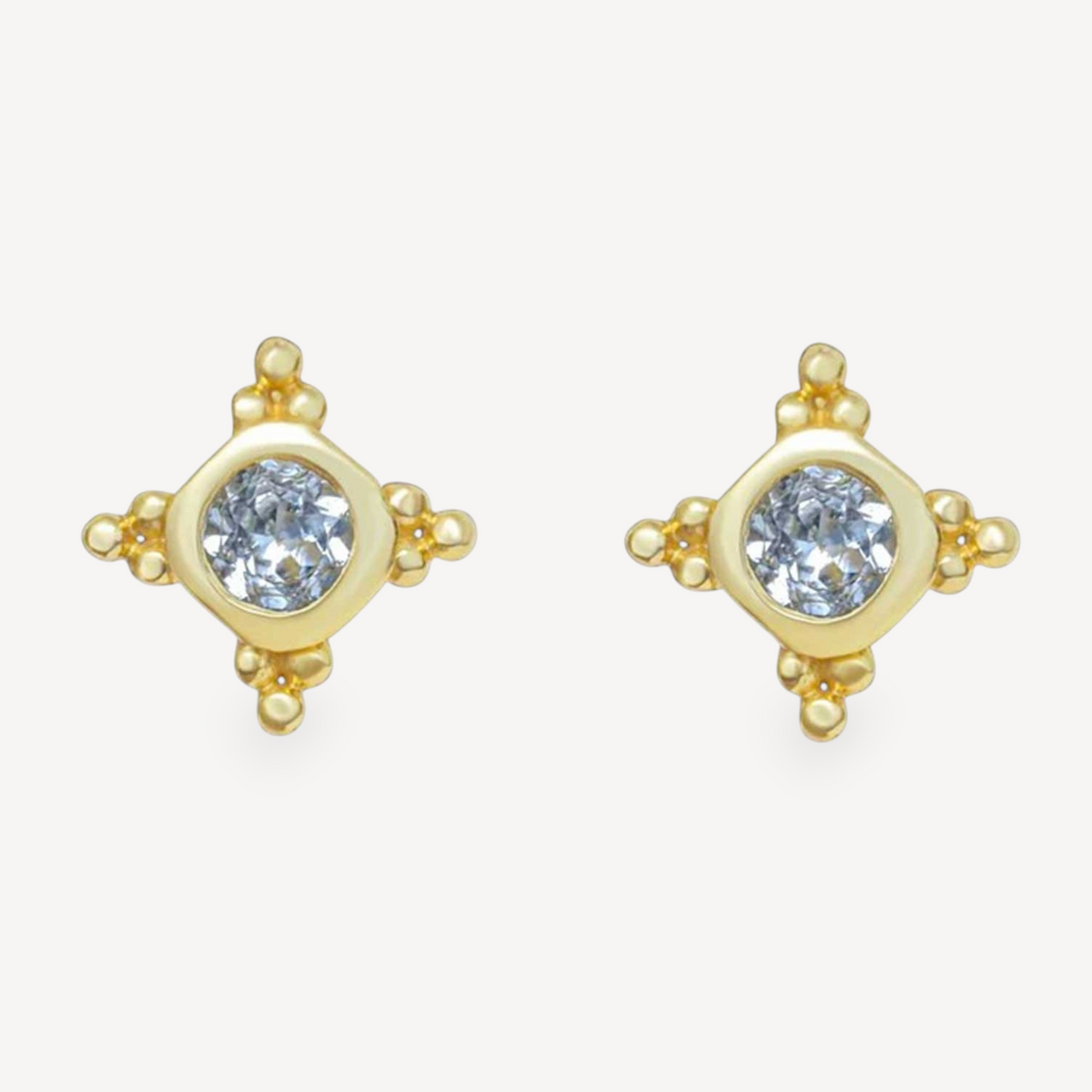 EC One STARBURST stud earrings featuring round blue topaz gemstones set in gold plated silver with star detailing.