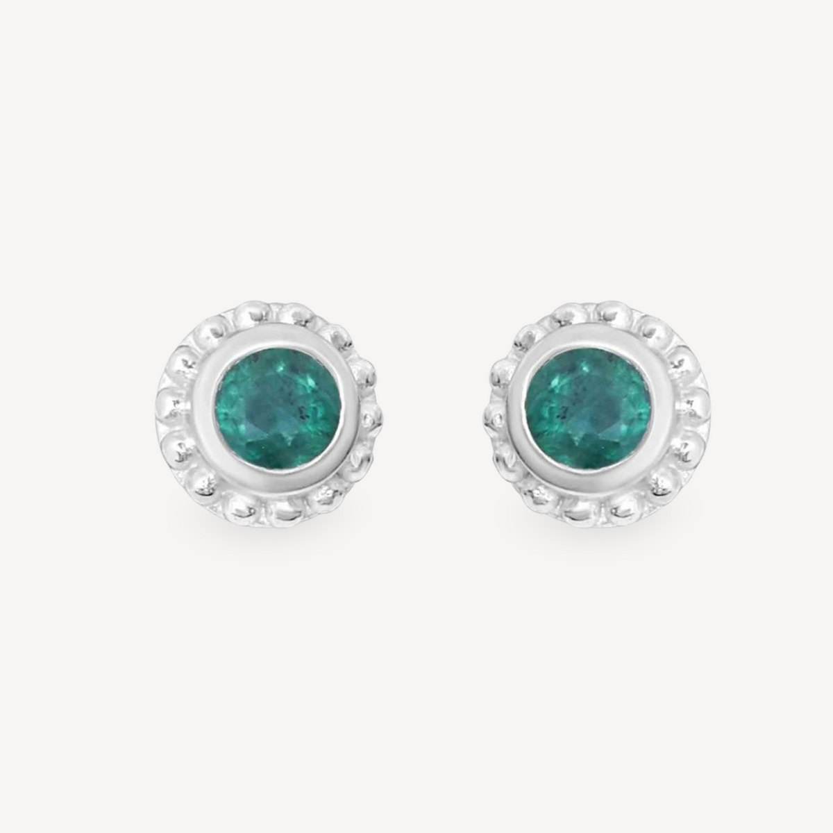 EC One SUNBEAM emerald stud earrings featuring round green gemstones set in textured silver frames