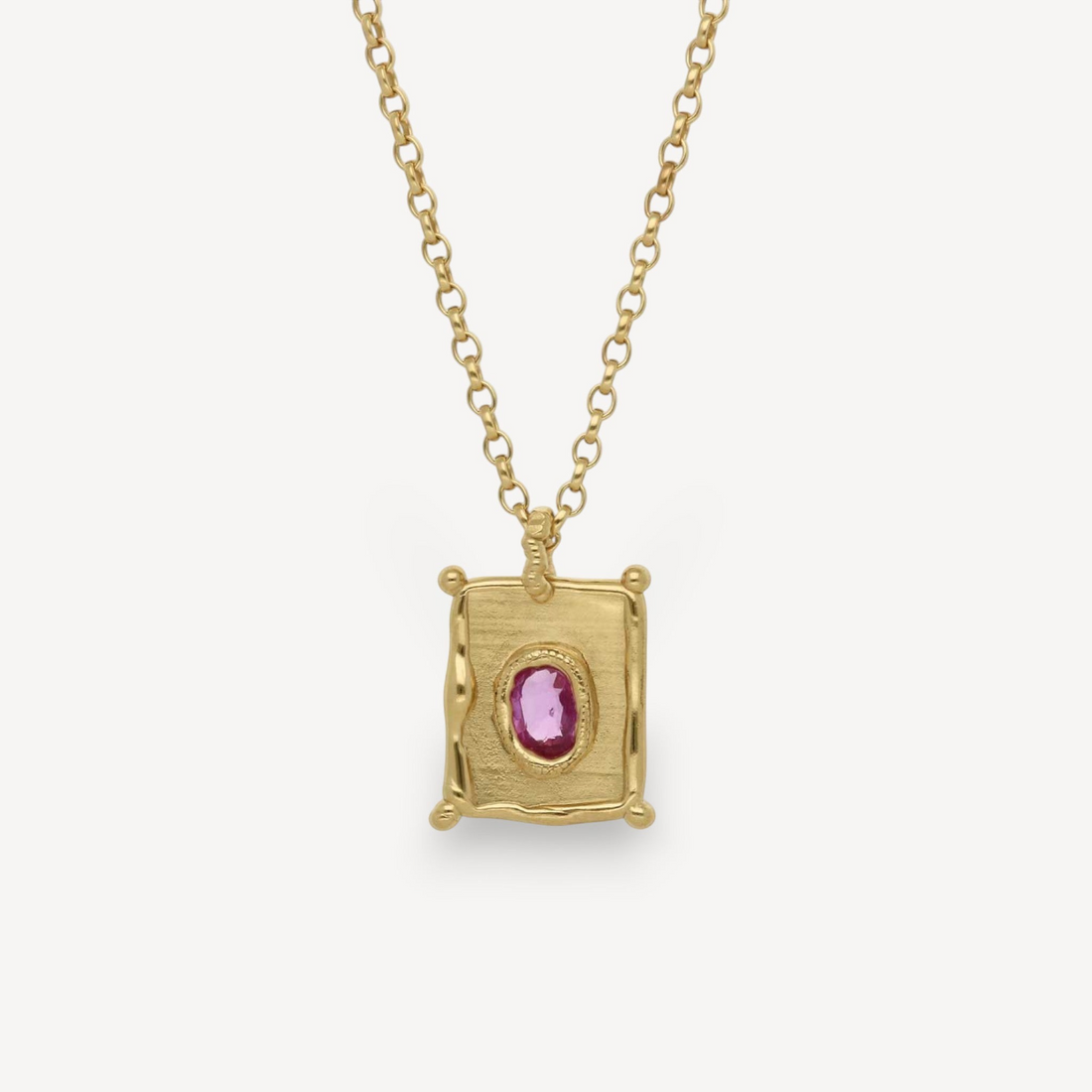 EC One TABLET mini pendant in gold plated recycled silver featuring a vibrant pink sapphire on a delicate chain