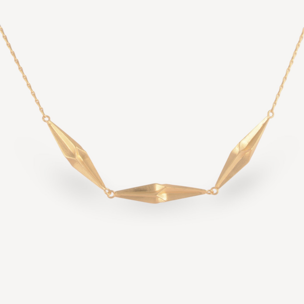 EC One Triple Shard necklace in gold plated recycled silver with three faceted hand-carved geometric pendants